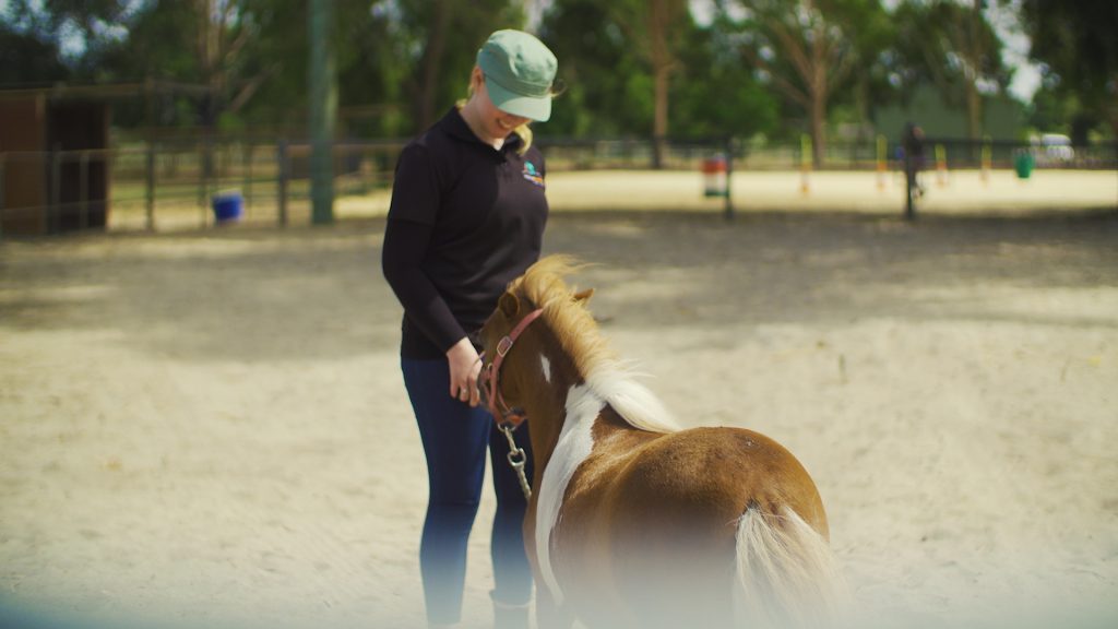 Shelly handling a horse at HorsePower